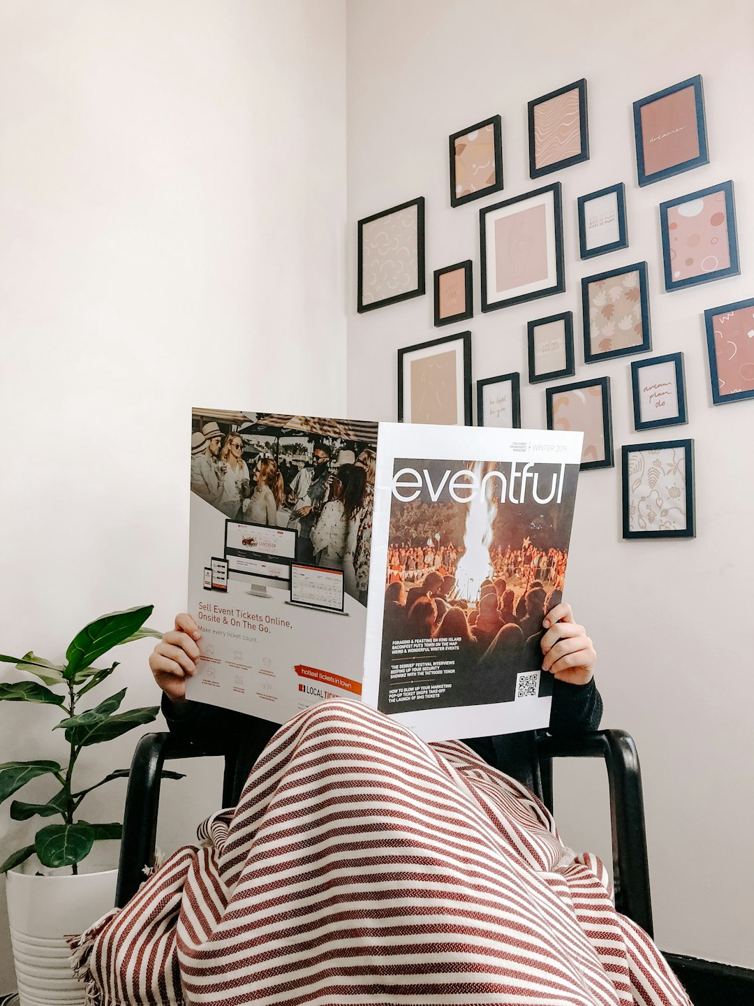 person-sitting-on-armchair-reading-magazine-efcyfi7ugay